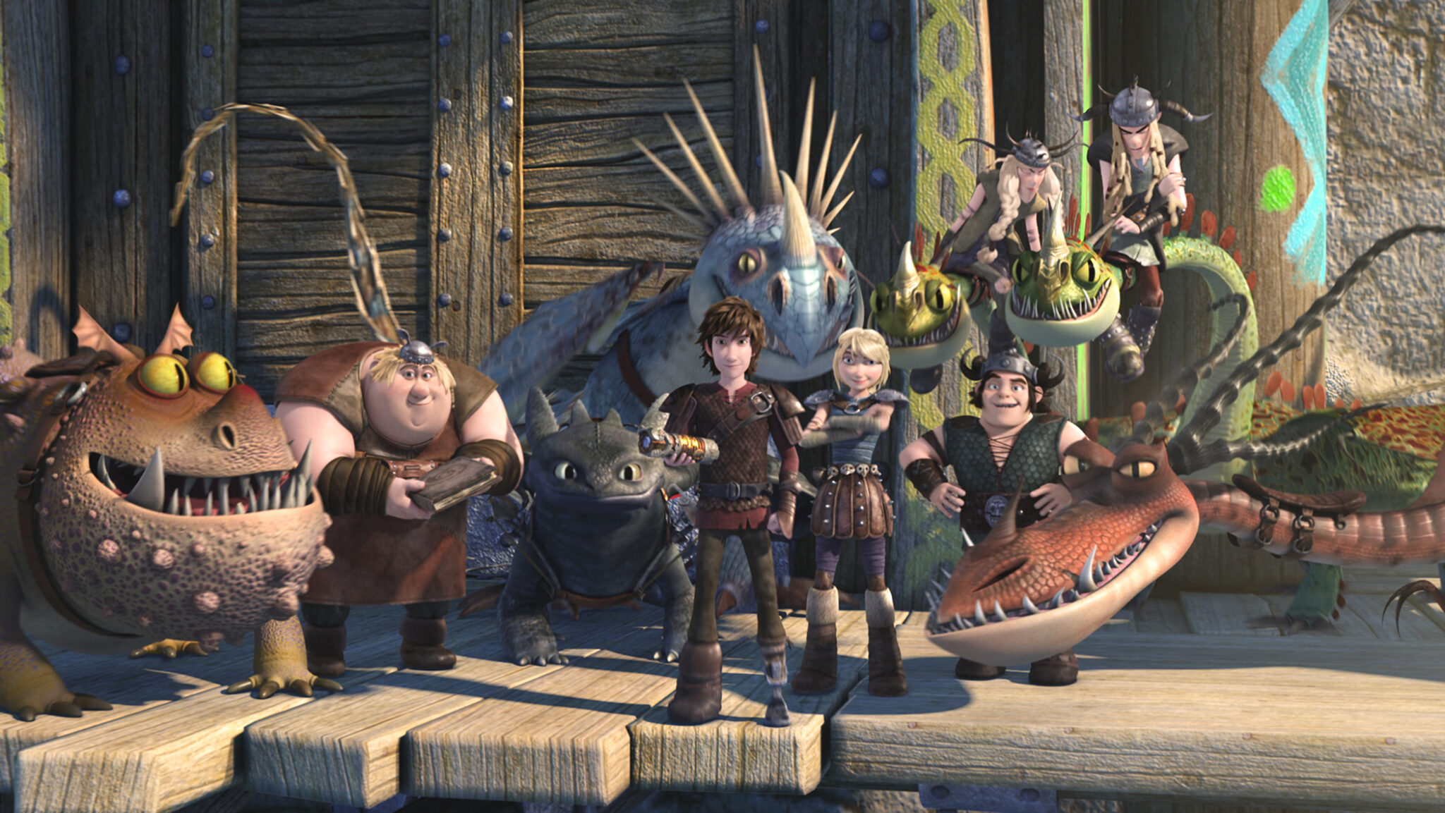 Ein Gruppenbild von Drachen und ihren Reitern aus der Serie Dragons. Kinderserien-Empfehlungen