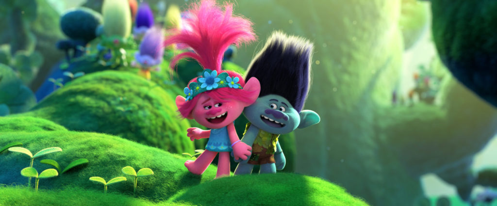 Poppy und Branch stehen singend auf einem grünen Ast, während sie sich an den Händen halten, Trolls World Tour
